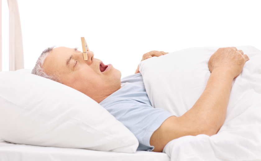man with clothes pin to stop snoring comedy.jpg